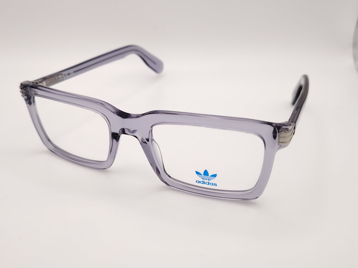 gafas de vista adidas or5115 con montura de acetato en gris translúcido y detalle metático en el talón
