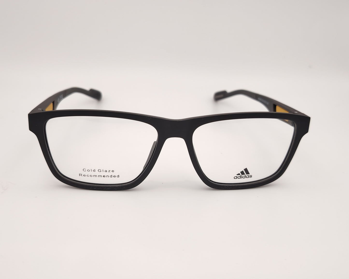 adidas sp5056 002 gafas de pasta en estilo deportivo en formato rectangular, color negro mate con detalles en naranja en las varillas