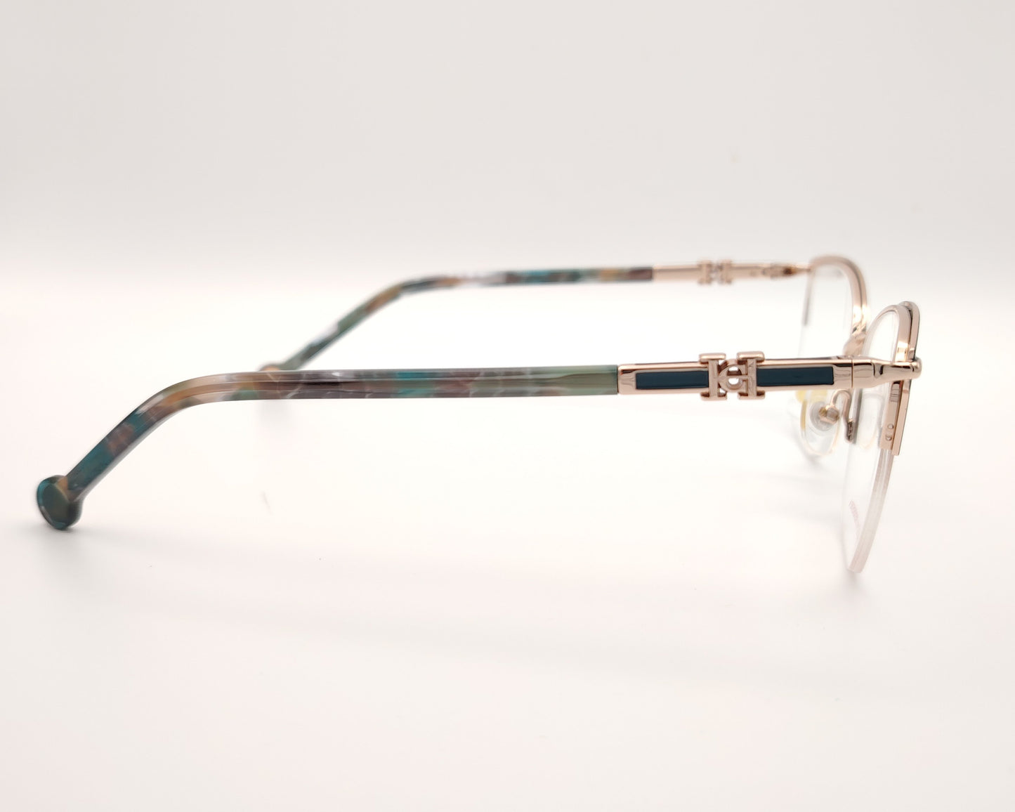 gafas de metal semi al aire carolina herrera en color verde y dorado