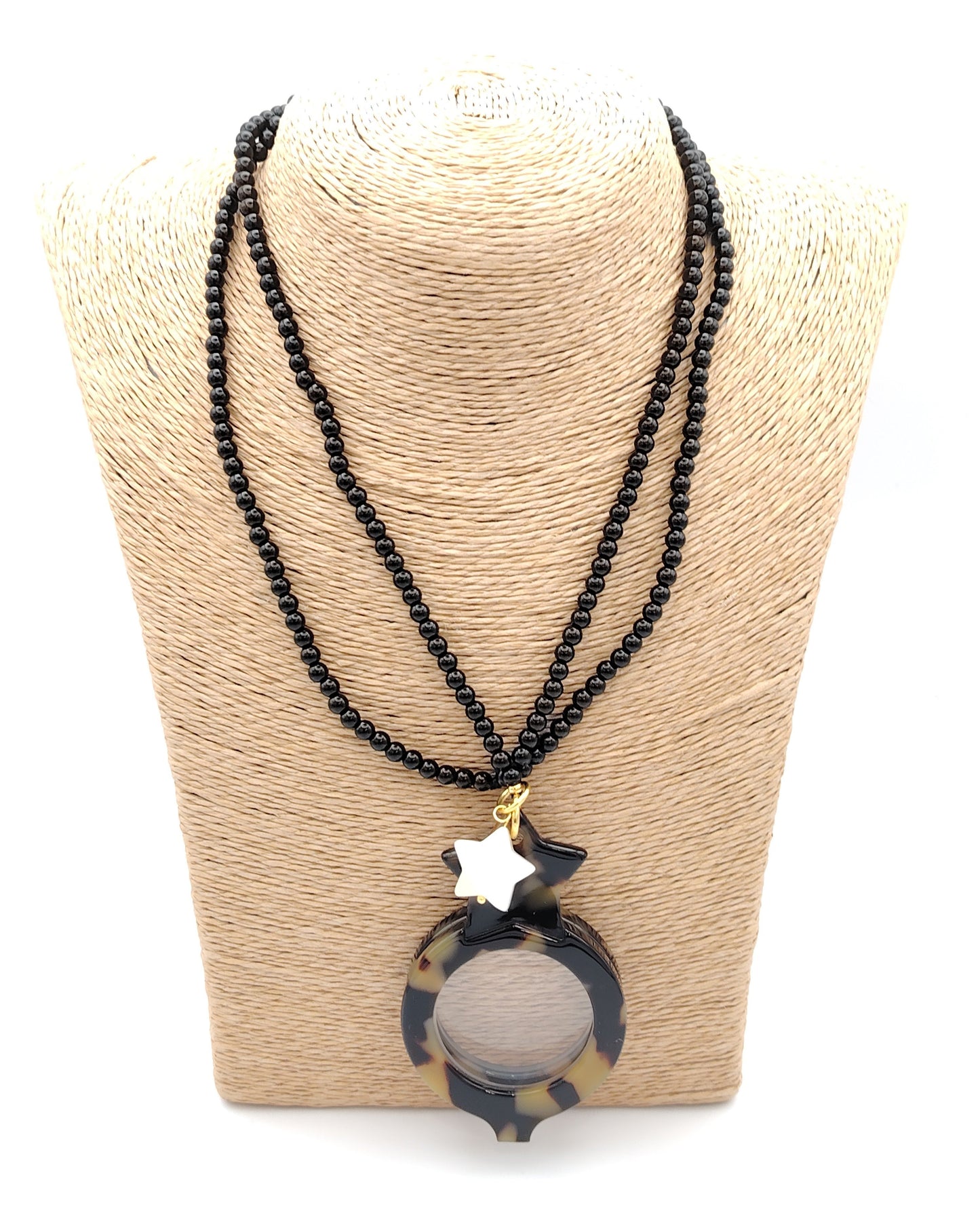 colgante lupa doble plegable con diseño carey y estrella blanca decorativa