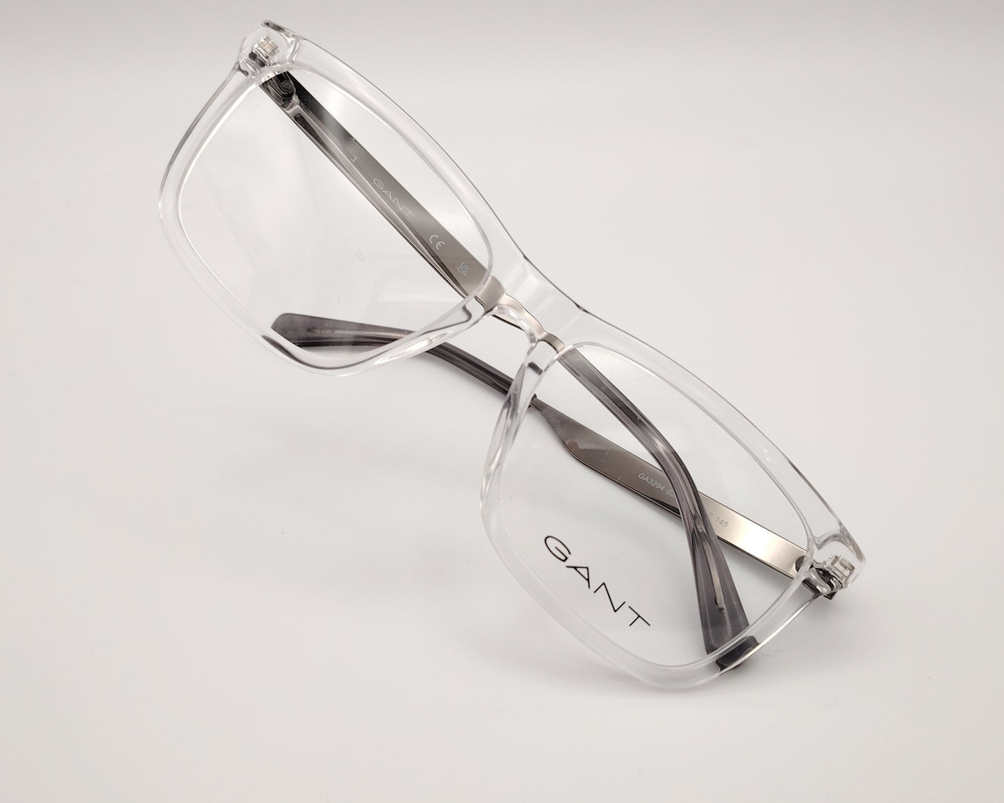 gant ga3294 026 gafas de vista con montura rectangular en acetato transparente varillas metálicas con el logo grabado, diseño moderno y ligero perfecto para un estilo sofisticado y versátil