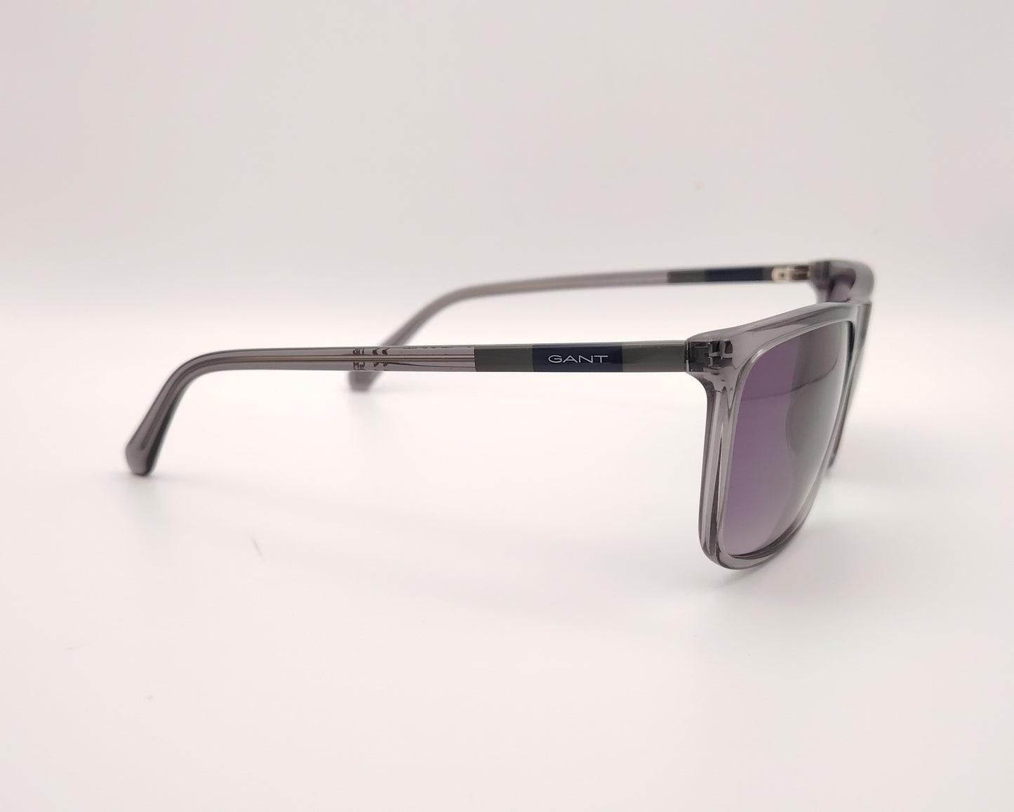gafas de sol gant ga7219 20b gris translúcido con lentes degradadas gris violeta