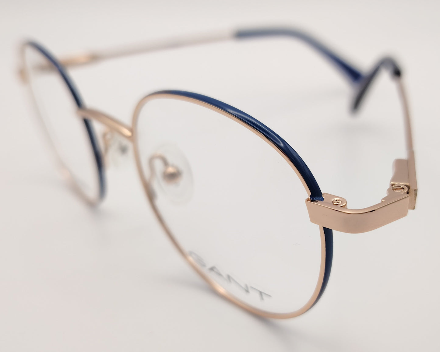 gant ga 3240 032 gafas graduadas montura metálica forma redonda, color oro rosa con los laterales del aro en azul ,varillas finas con terminales en azul