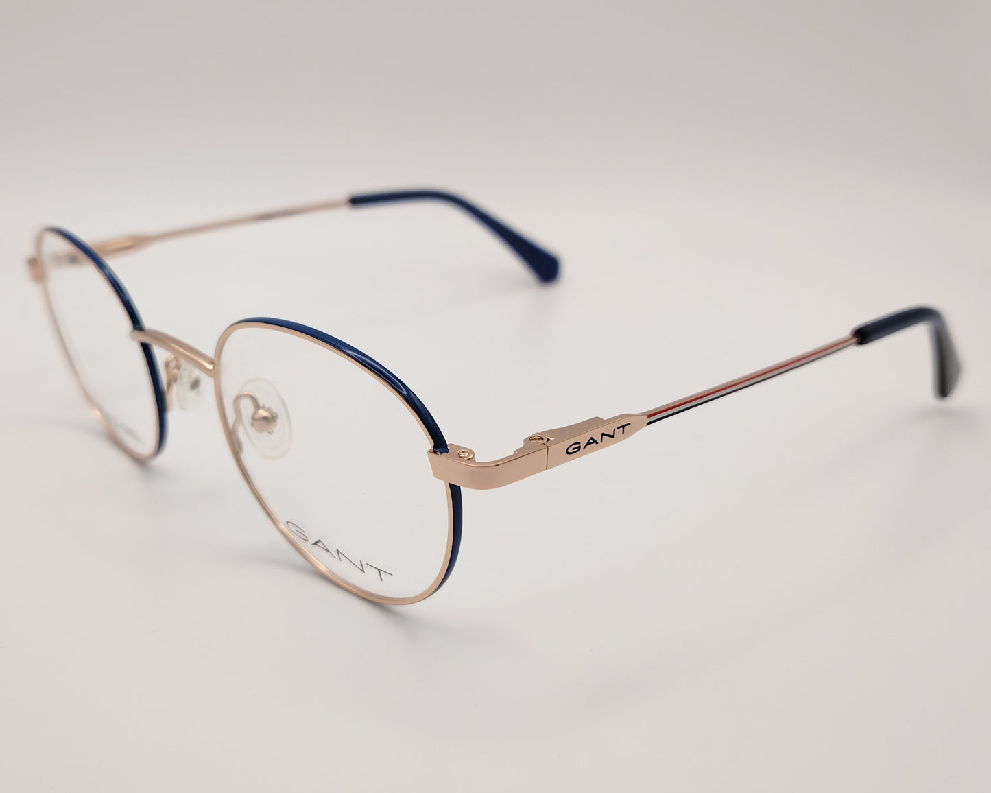 gant ga 3240 032 gafas graduadas montura metálica forma redonda, color oro rosa con los laterales del aro en azul ,varillas finas con terminales en azul