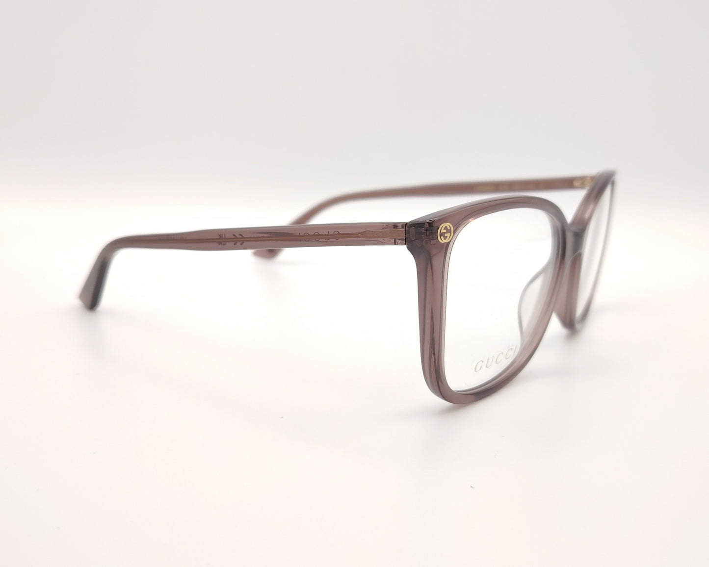 gafas gucci color malva con forma mariposa y detalles dorados