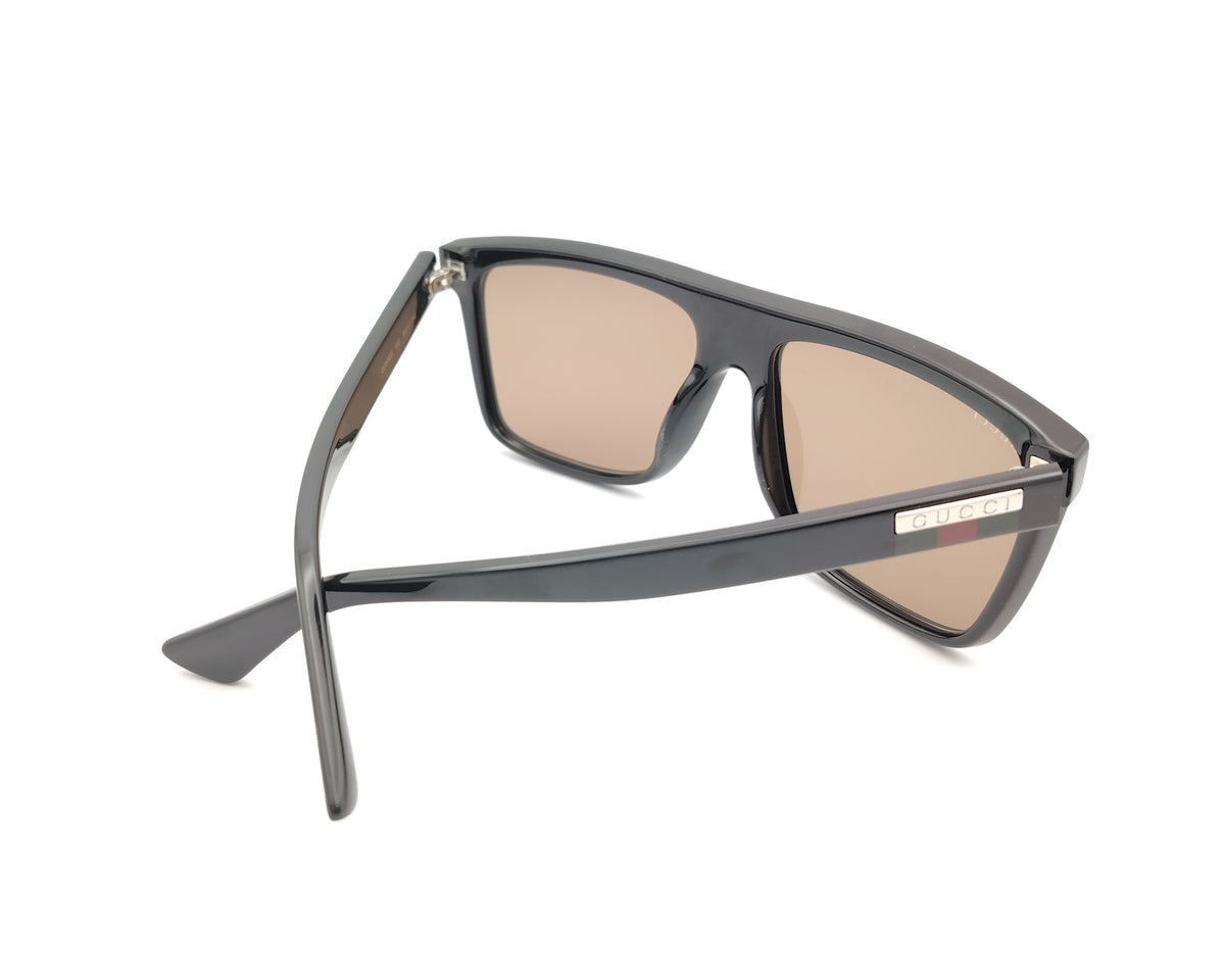 gafas de sol guci gg0748s de pasta negra con cristales marrones y logo en las varillas