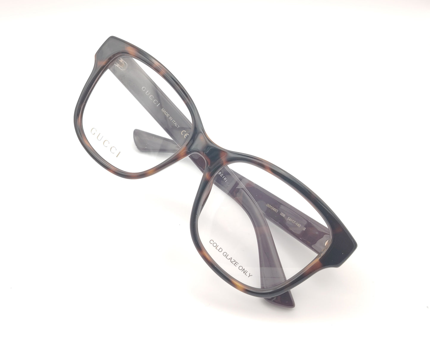 gafas graduadas gucci con frontal carey y patillas berenjena con logo dorado