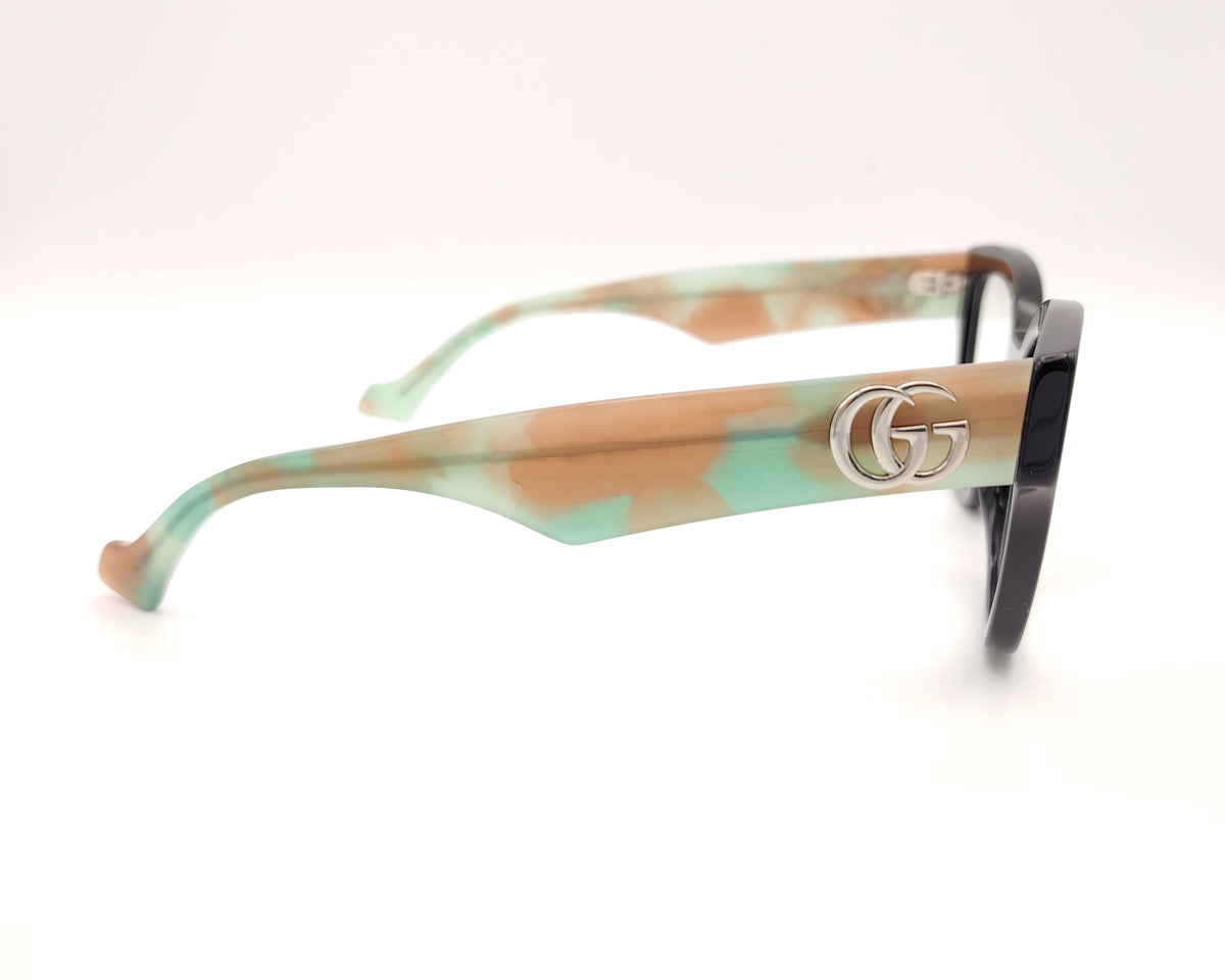 gafas gucci en acetato carey con varillas en verde y beige y logo gg plateado