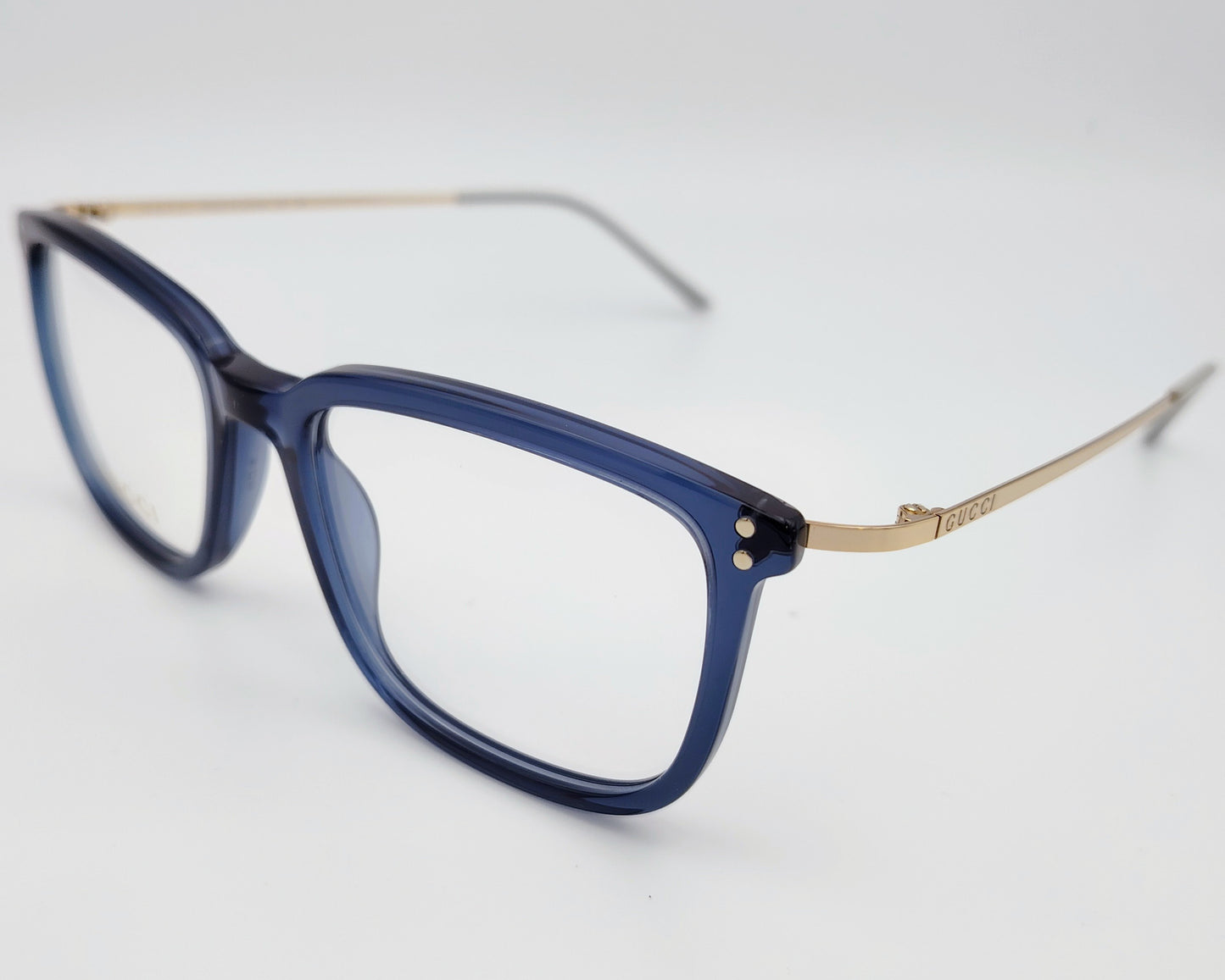 gucci gg1709o 007 gafas en formato cuadrado con los bordes redondeados de acetato en azul traslúcido con las varillas en metal dorado