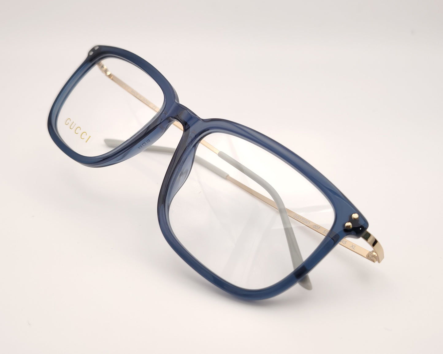 gucci gg1709o 007 gafas en formato cuadrado con los bordes redondeados de acetato en azul traslúcido con las varillas en metal dorado