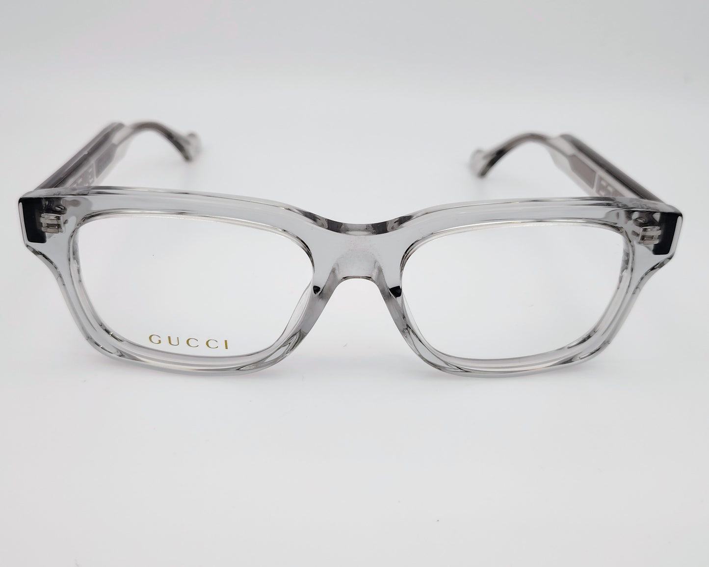 gucci gg17310 003 gafas de acetato en formato cuadrado con los bordes redondeados en color gris traslúcido y logo gucci en las varillas