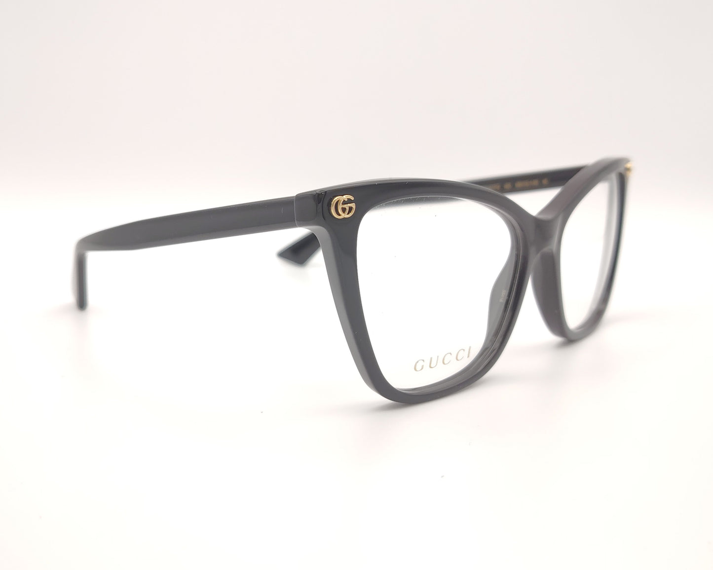 gafas graduadas gucci negras con forma cat eye y detalle dorado en la varilla