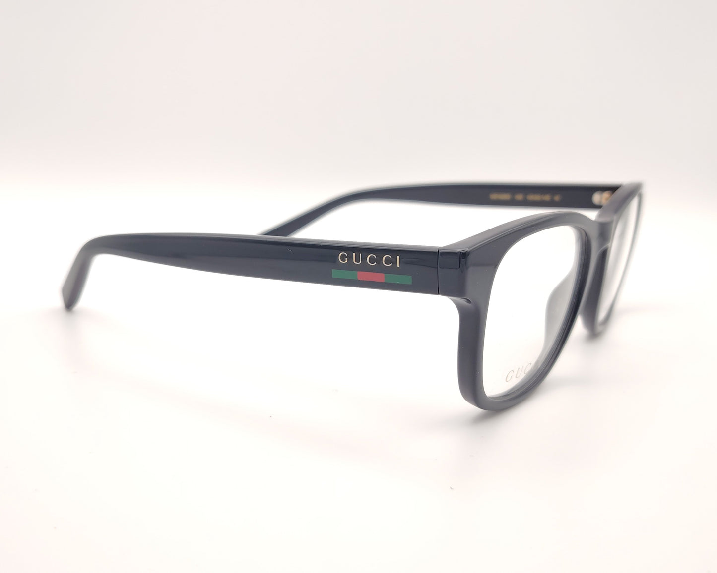 gafas gucci en pasta azul marino con logo dorado en las varillas