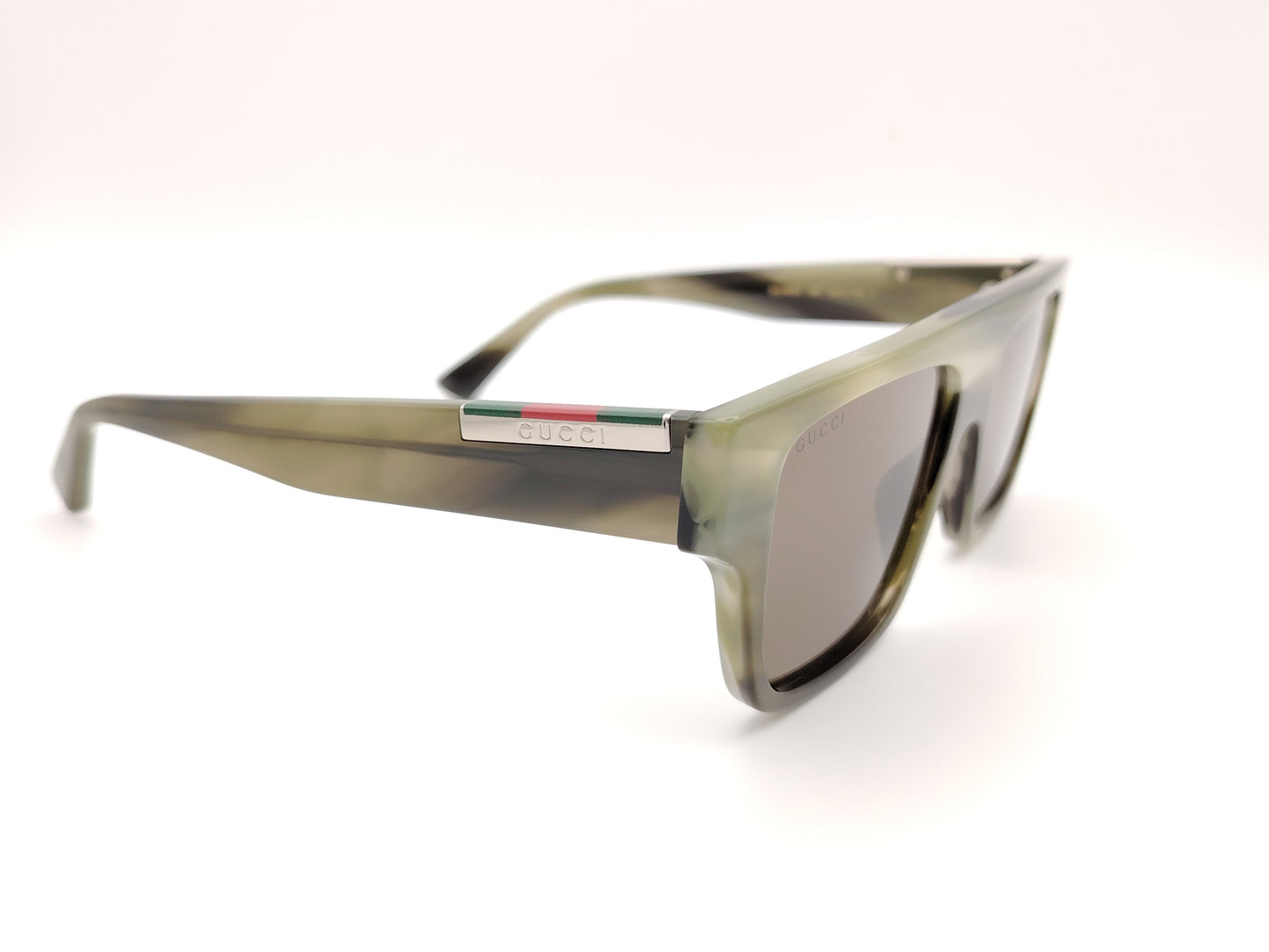 gafas de sol gucci con montura cuadrada verde translúcida y lentes marrones