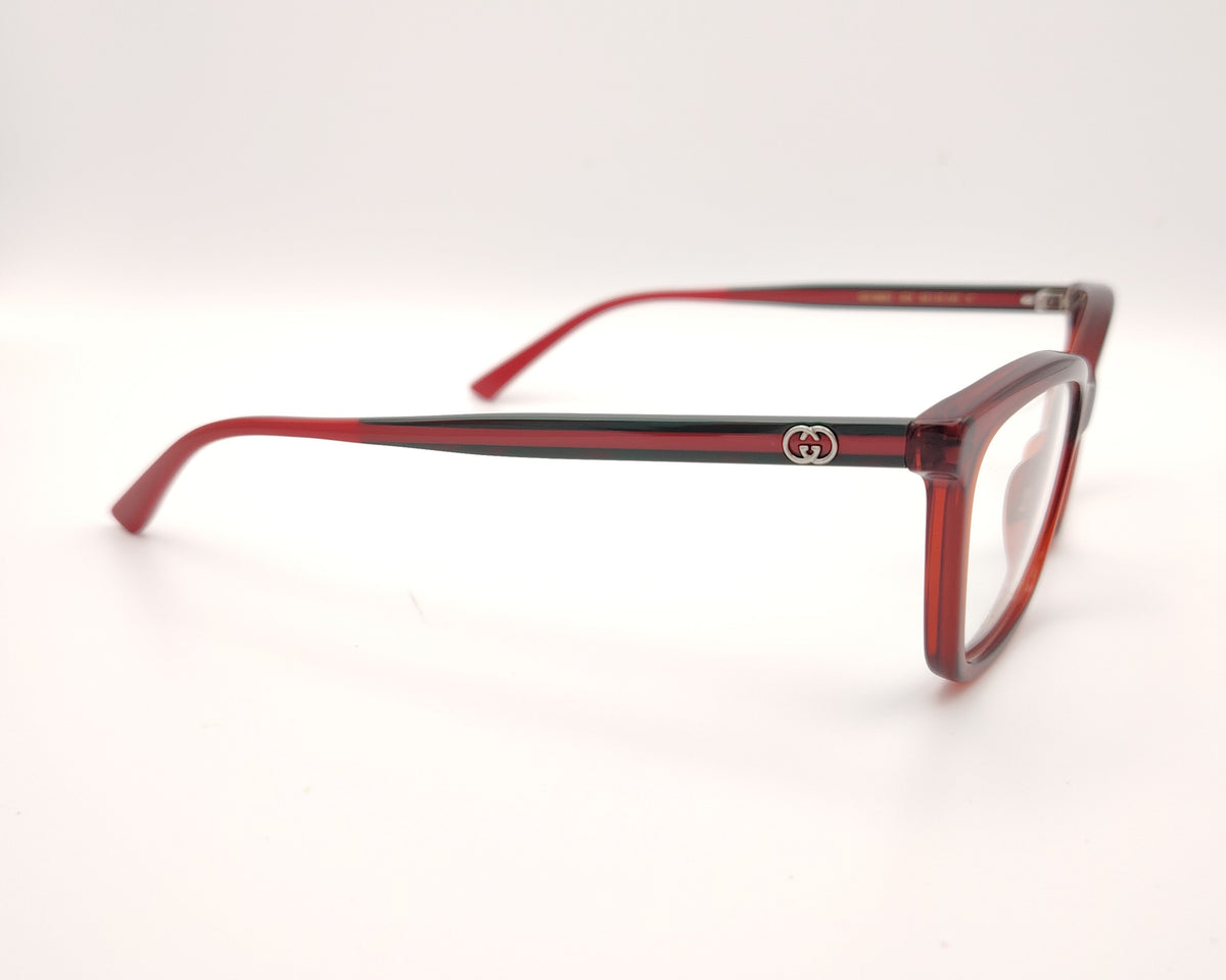 gafas gucci graduadas con montura roja translúcida varillas en rojo y verde y detalle gg metálico