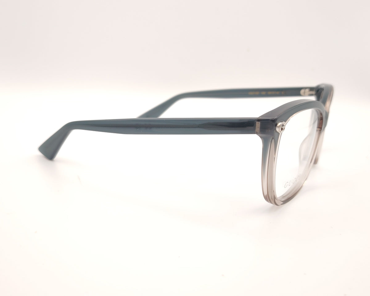 gafas gucci graduadas con montura degradada gris humo y transparente y detalle gg metálico