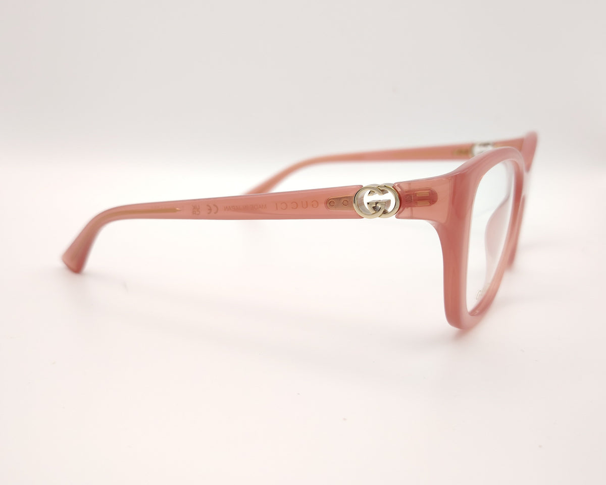gafas gucci graduadas rosas translúcidas con forma cat eye y detalle gg dorado