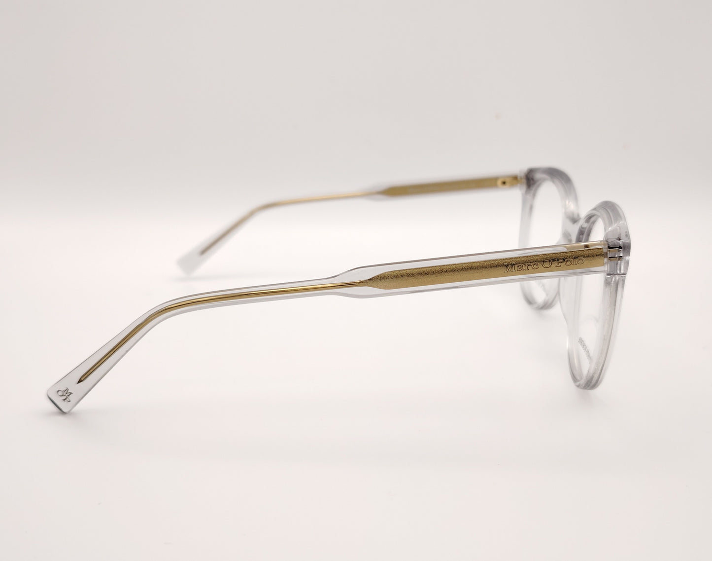 gafas graduadas marc o polo de forma redondeada en acetato transparente con varillas metálicas doradas
