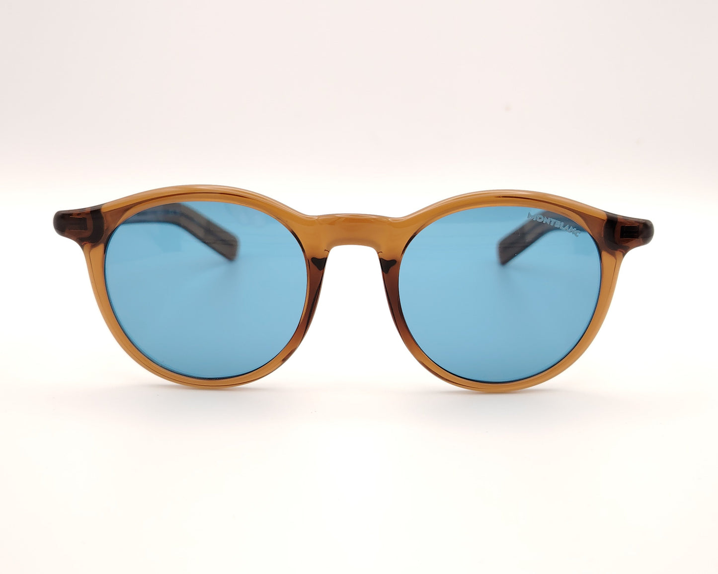gafas de sol montblanc redondas con montura color ámbar y cristales azules