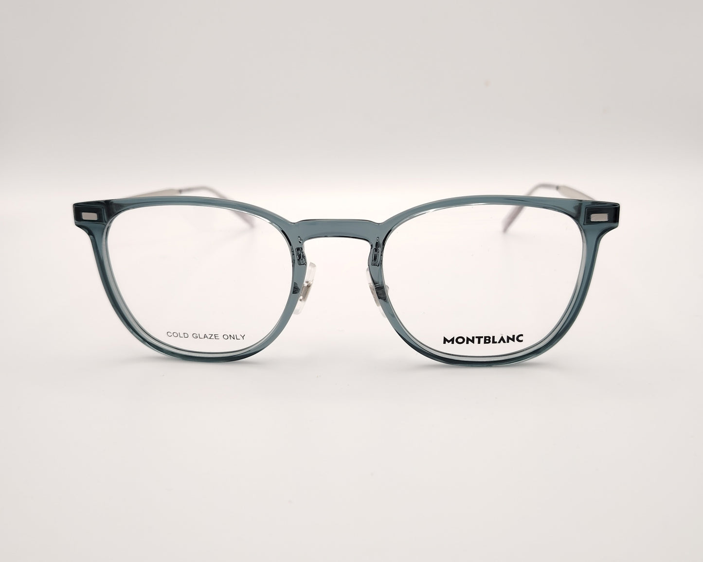 gafas montblanc con montura azul translúcida rectangular y varillas metálicas en plata