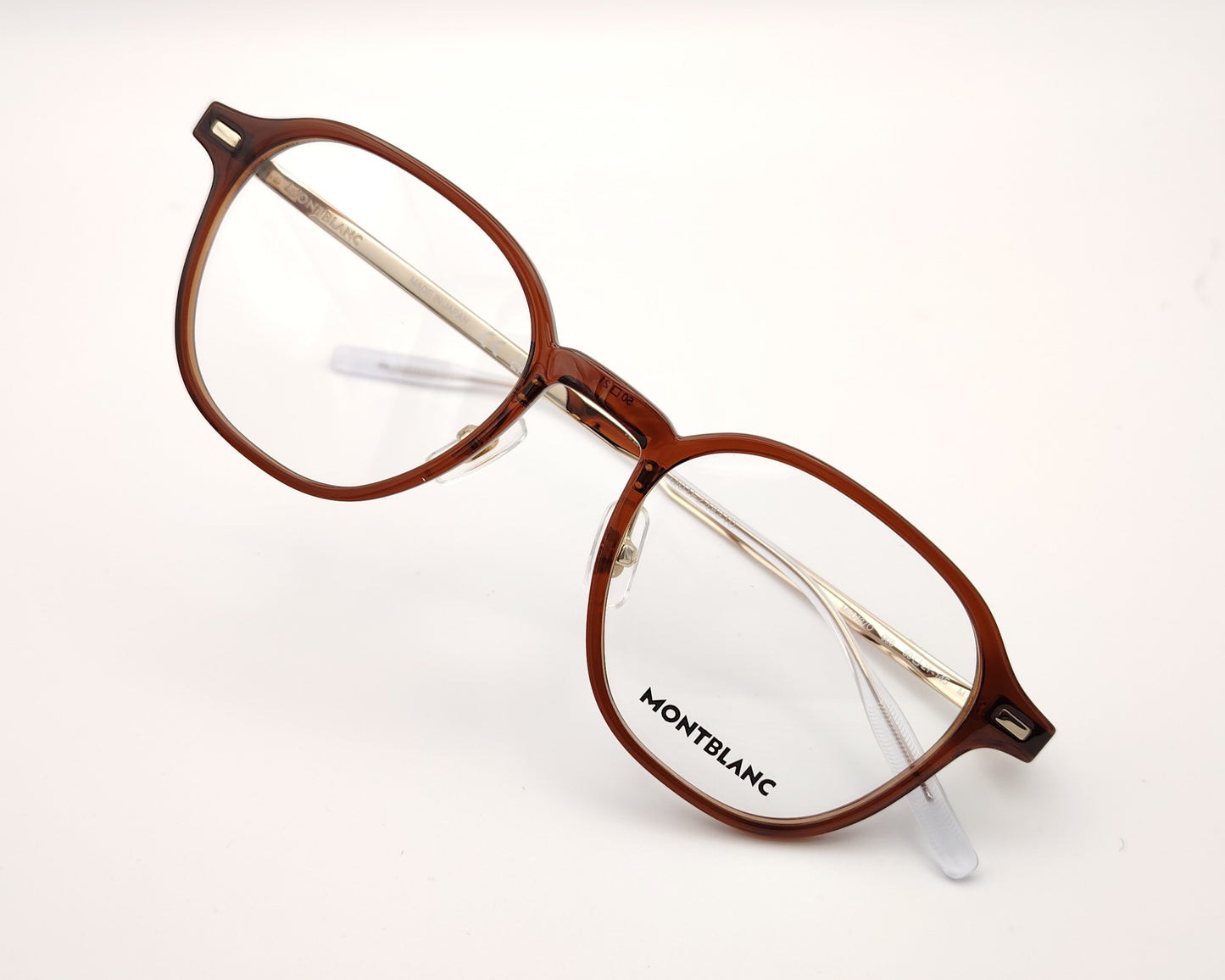 gafas montblanc semi redondas con frontal marrón translúcido y varillas metálicas finas