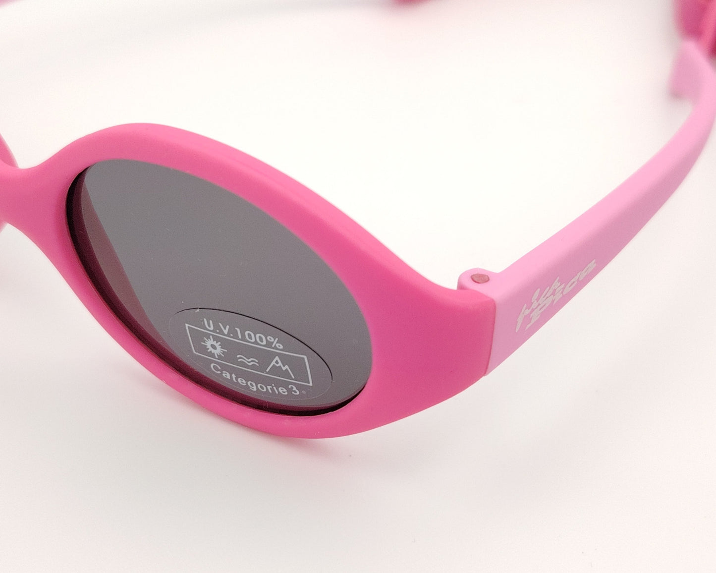 gafas de sol para bebé en color rosa con lentes oscuras redondeadas y protección UV