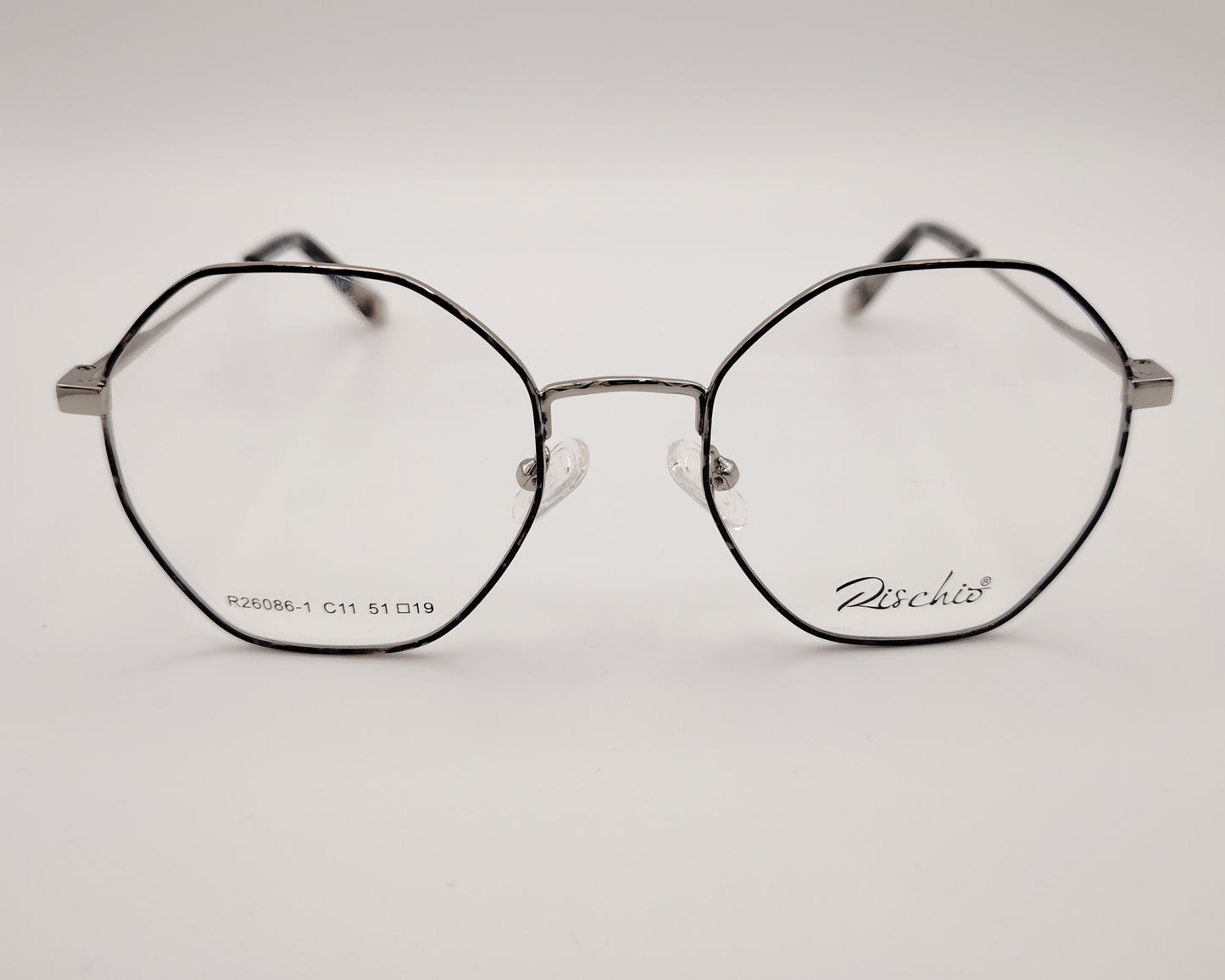 rischio r26086 c11 gafas de vista con montura metálica octogonal en color plateado con lacado jaspeado gris en
el frente, varillas finas y plaquetas ajustables diseño ligero y moderno