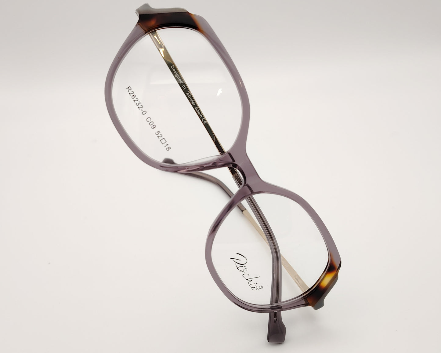 gafas graduadas rischio r26171 c11 con montura de acetato en tonos gris degradado diseño rectangular con varillas metálicas grabadas