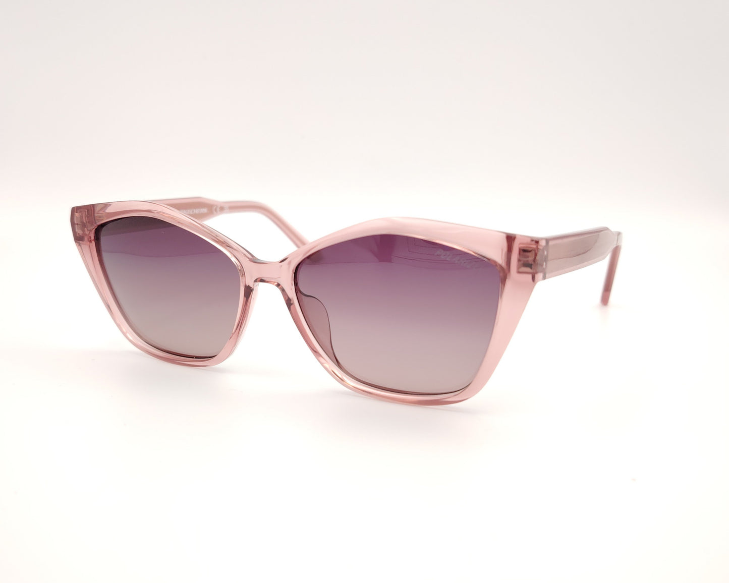 gafas de sol skechers se00035 72h con montura rosa transparente forma cat eye y lentes moradas degradadas polarizadas