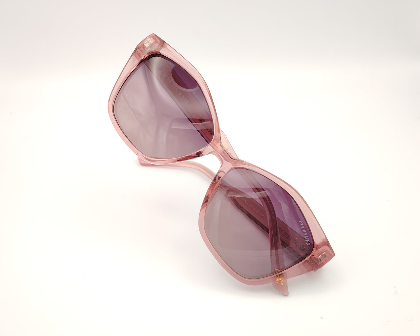 gafas de sol skechers se00035 72h con montura rosa transparente forma cat eye y lentes moradas degradadas polarizadas