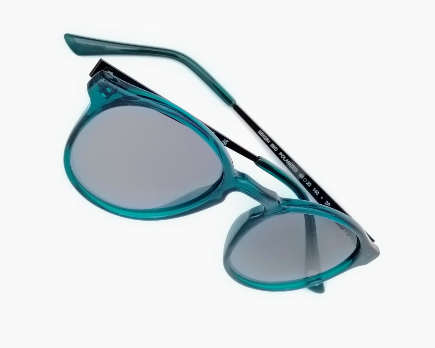 skechers se6284 89d gafas de sol de niños y cadetes redondas de pasta de color azul petróleo con las varillas en metal grafito y las lentes polarizadas grises