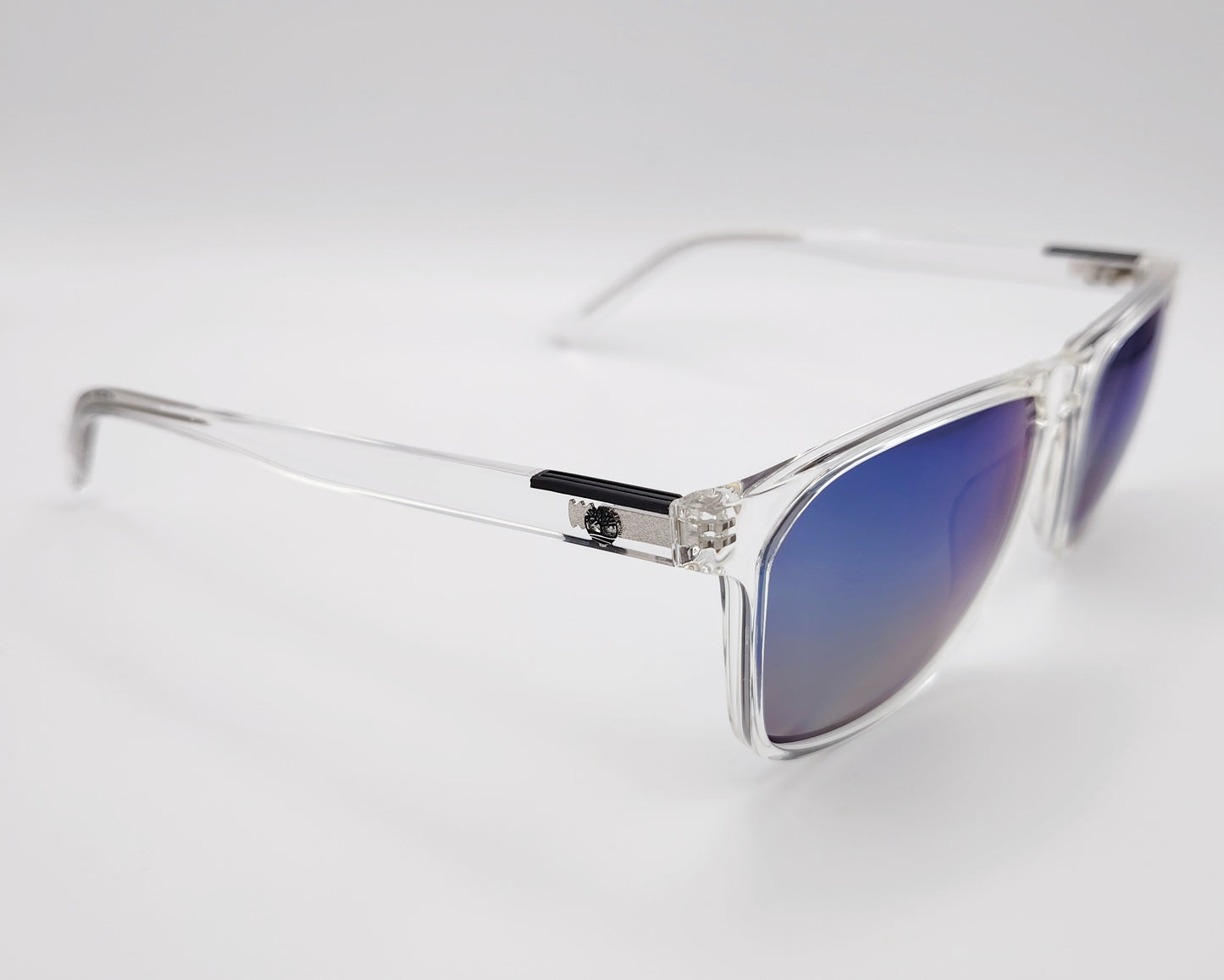 gafas de sol timberland tb9312 con montura cuadrada en transparente y lentes polarizadas espejadas en azul