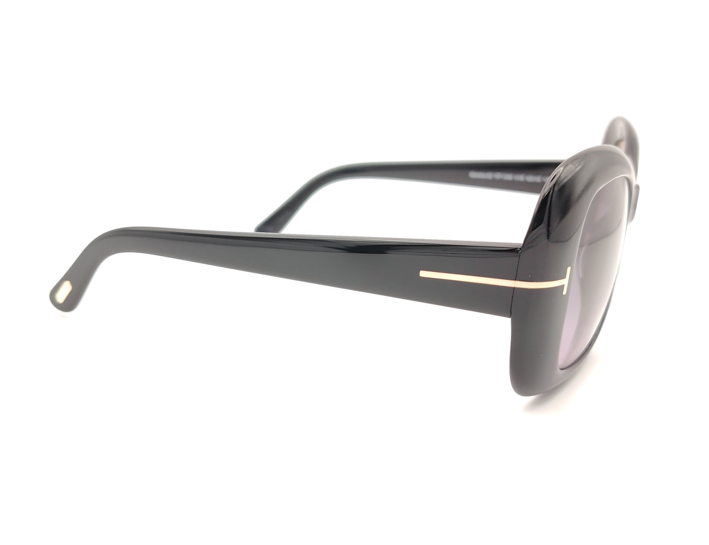 gafas de sol tom ford negras oversize con lentes violetas y detalle metálico en las varillas