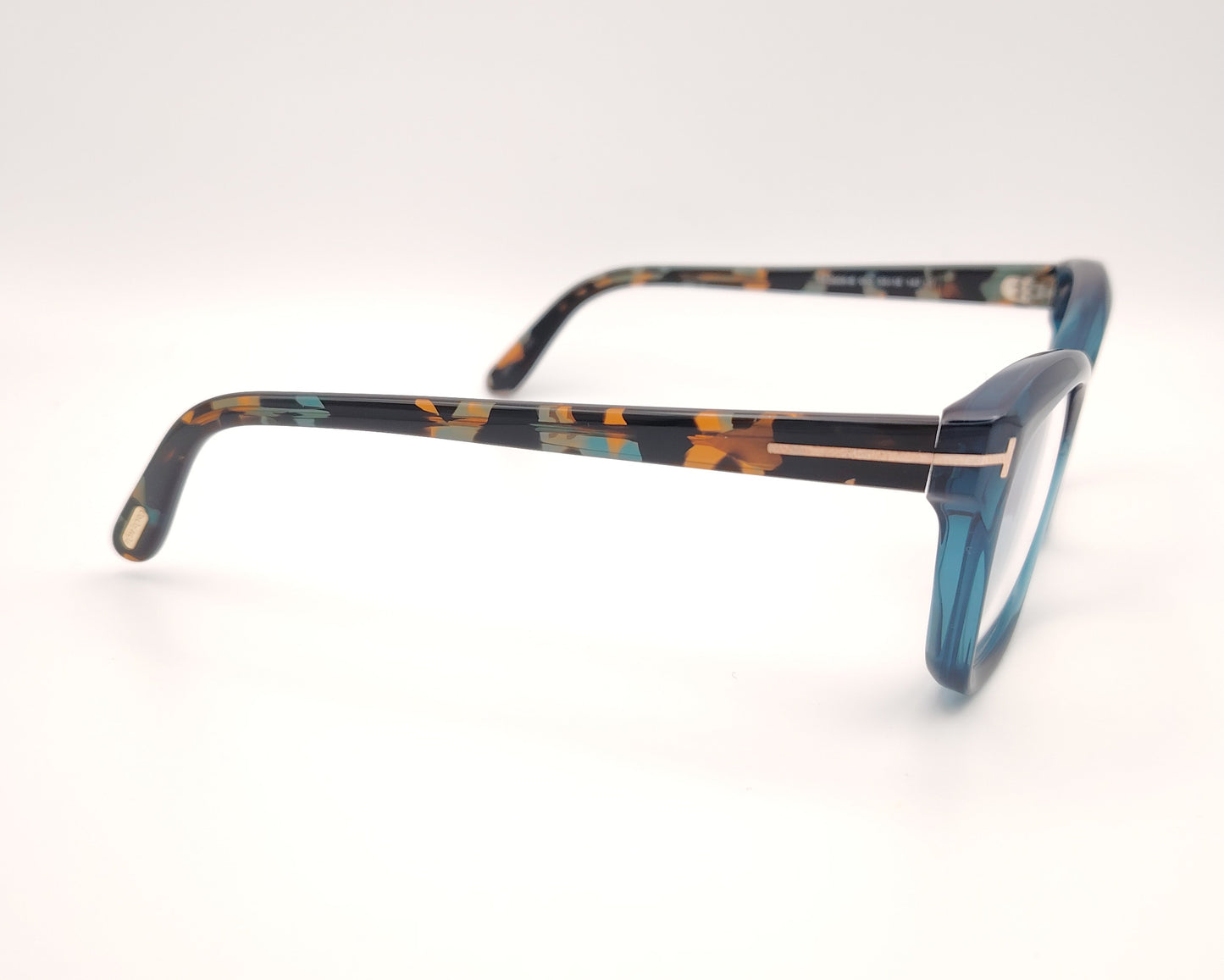 gafas tom ford tf5909b 092 con montura de acetato azul translúcida y varillas jaspeadas habana y detalles metálicos