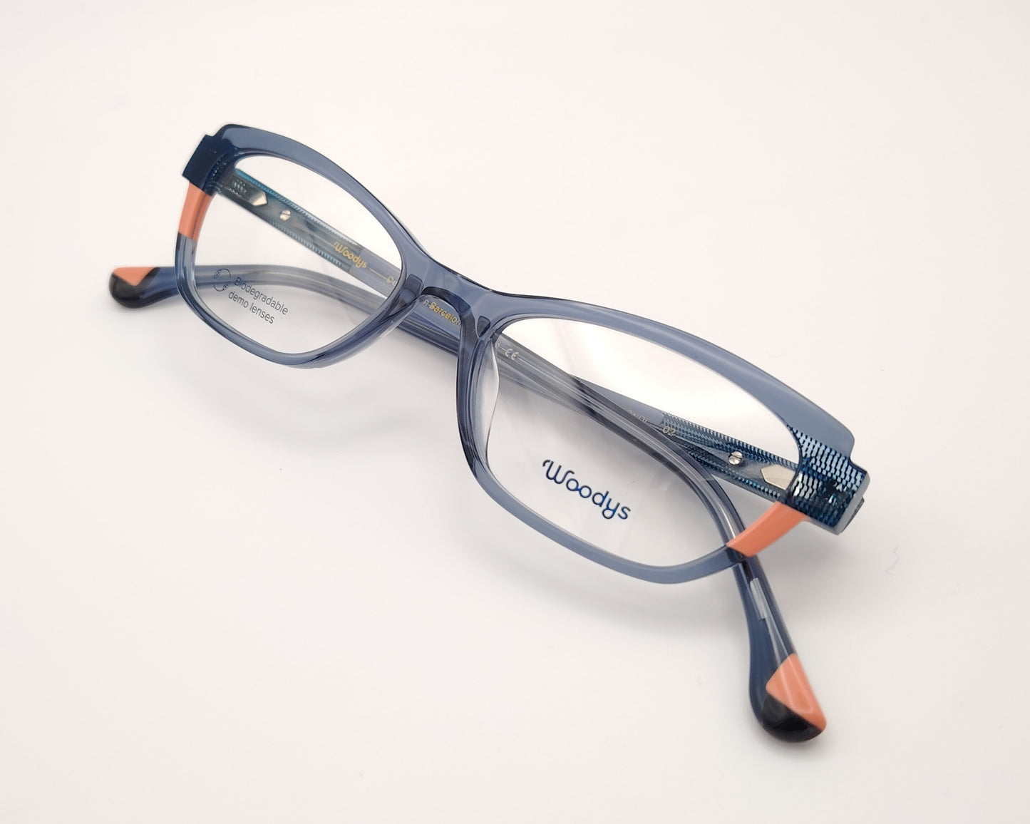 woodys bondy 02 gafas de vista con montura de acetato en azul traslúciso con detalles en rosa, diseño media luna ideal para gafas de lectura