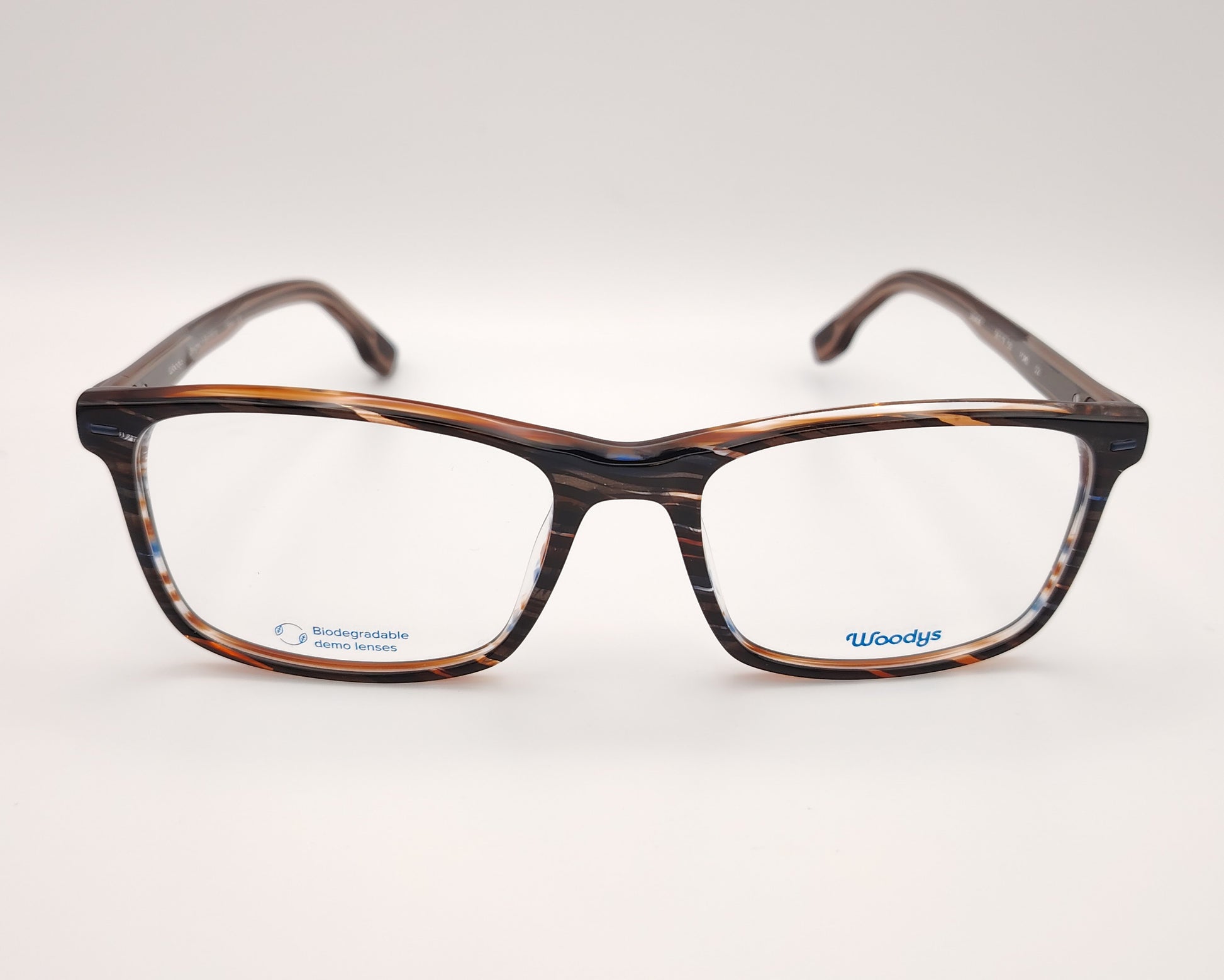 gafas graduadas woodys ford 02 con montura rectangular de acetato en tonalidades carey con detalles en azul y blanco siguiendo un patrón rayado diseño ligero