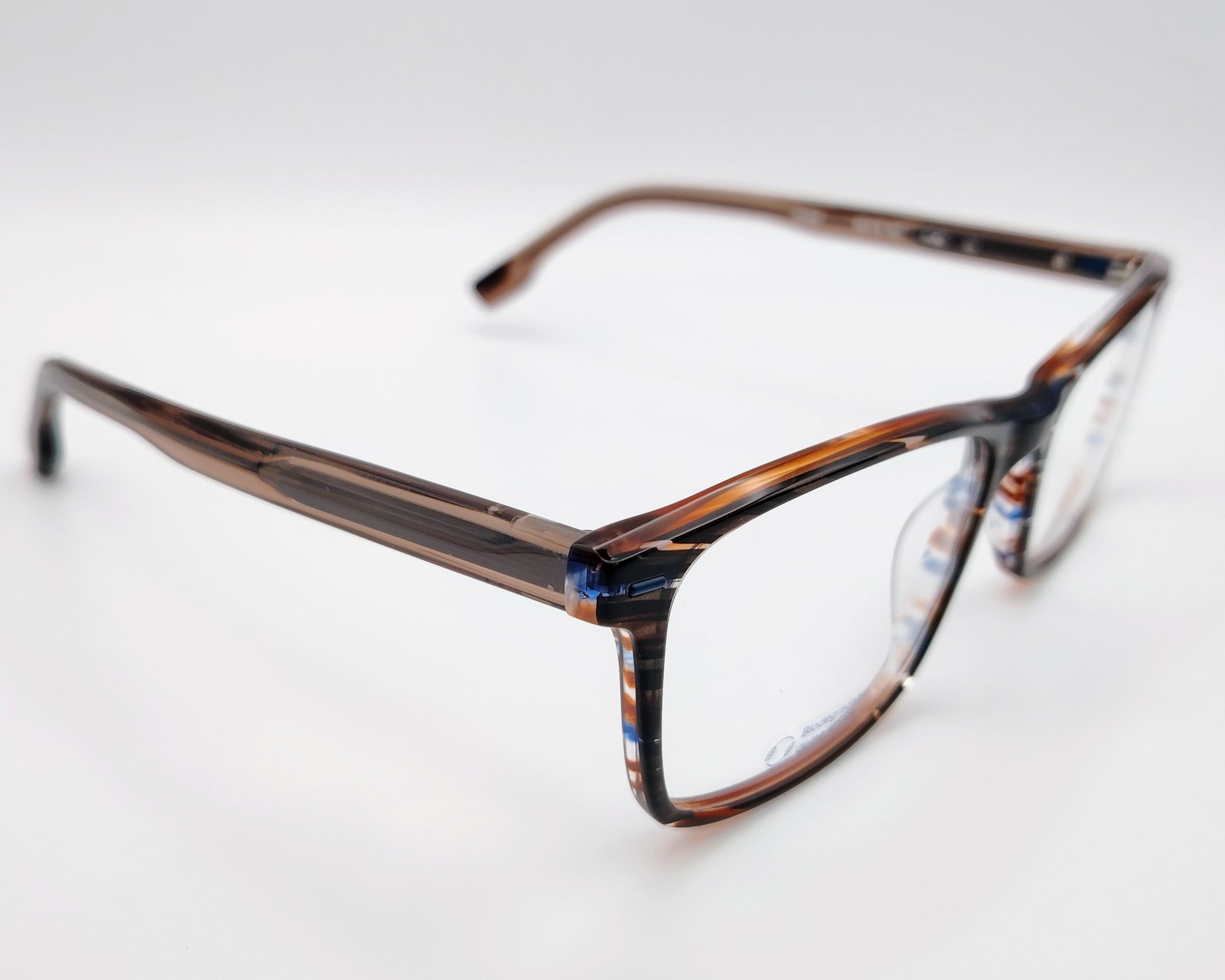 gafas graduadas woodys ford 02 con montura rectangular de acetato en tonalidades carey con detalles en azul y blanco siguiendo un patrón rayado diseño ligero