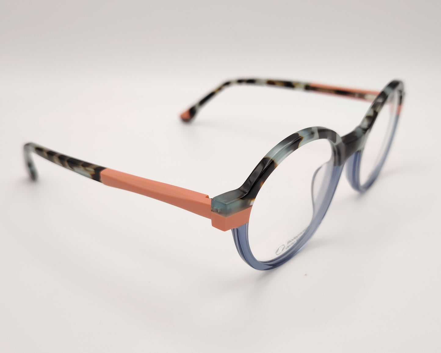 gafas graduadas redondeadas con montura multicolor en tonos azul, coral y carey