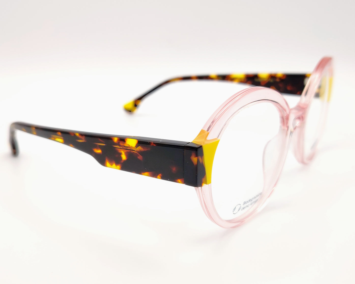 gafas graduadas woodys kilda 05 con montura de acetato en color rosa claro translúcido diseño redondo con detalles geométricos en amarillo y carey en las esquinas varillas en carey