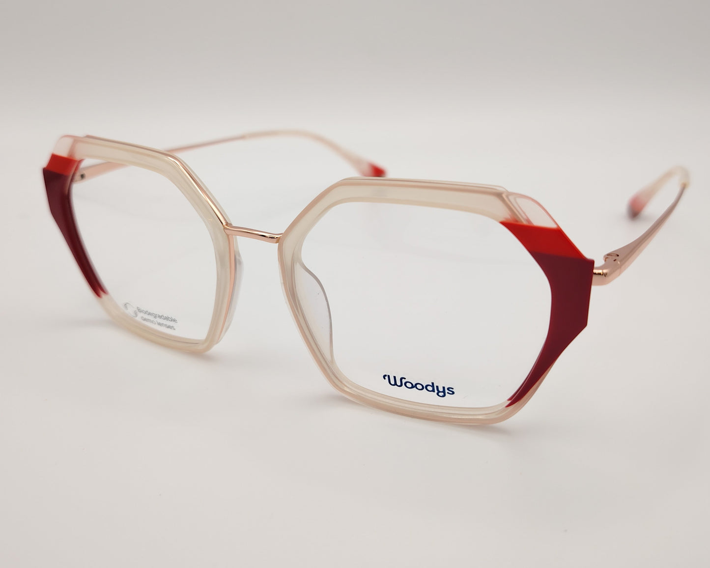 gafas graduadas woodys massena 04 con montura geométrica en metal y acetato translúcido en tono beige detalles en rojo en las esquinas varillas metálicas en color oro diseño sofisticado y ligero