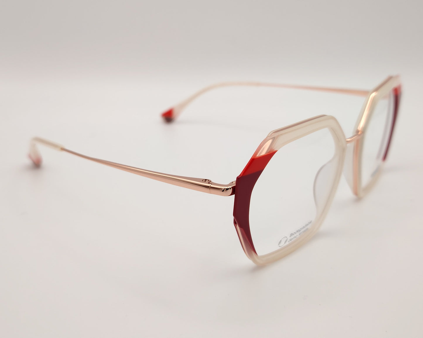 gafas graduadas woodys massena 04 con montura geométrica en metal y acetato translúcido en tono beige detalles en rojo en las esquinas varillas metálicas en color oro diseño sofisticado y ligero