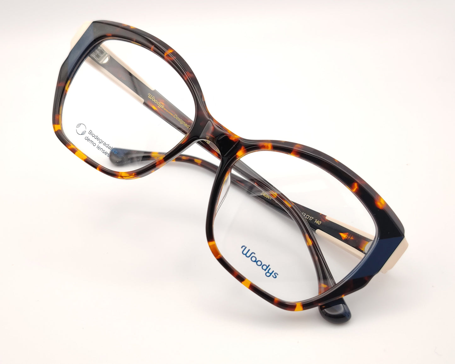 gafas graduadas woodys midway 02 con montura de acetato en estampado habana y detalle en azul en la parte exterior de diseño geométrico elegante con detalles en tono marfil en las varillas