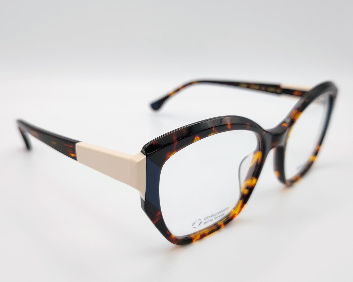 gafas graduadas woodys midway 02 con montura de acetato en estampado habana y detalle en azul en la parte exterior de diseño geométrico elegante con detalles en tono marfil en las varillas