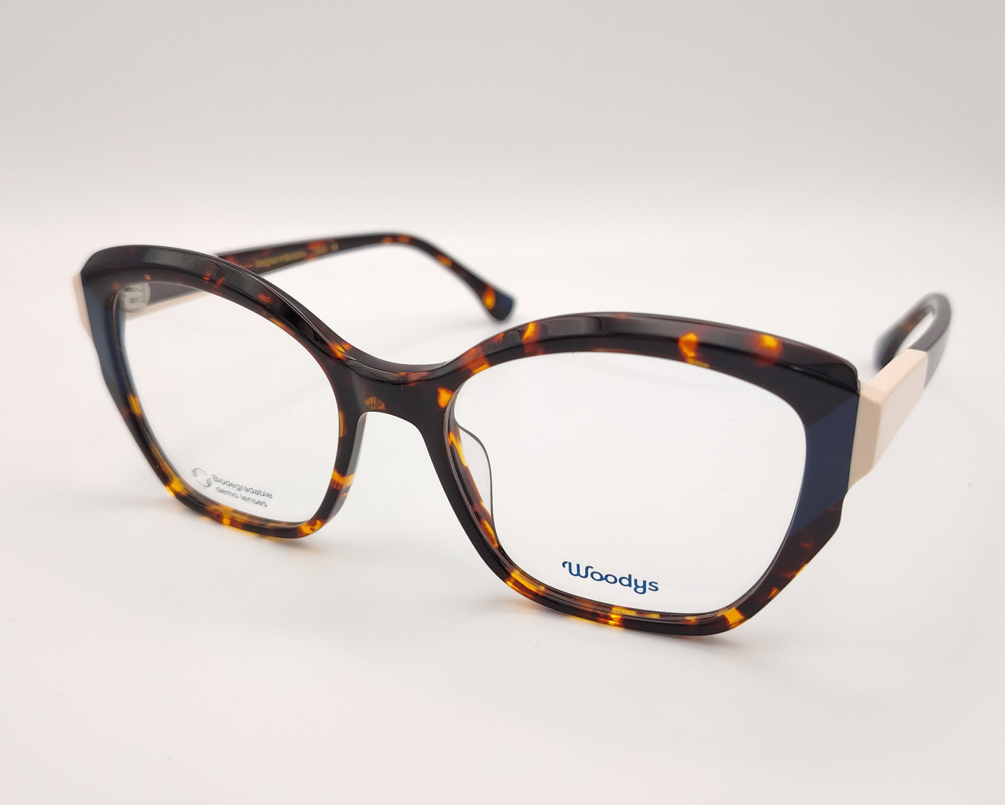 gafas graduadas woodys midway 02 con montura de acetato en estampado habana y detalle en azul en la parte exterior de diseño geométrico elegante con detalles en tono marfil en las varillas
