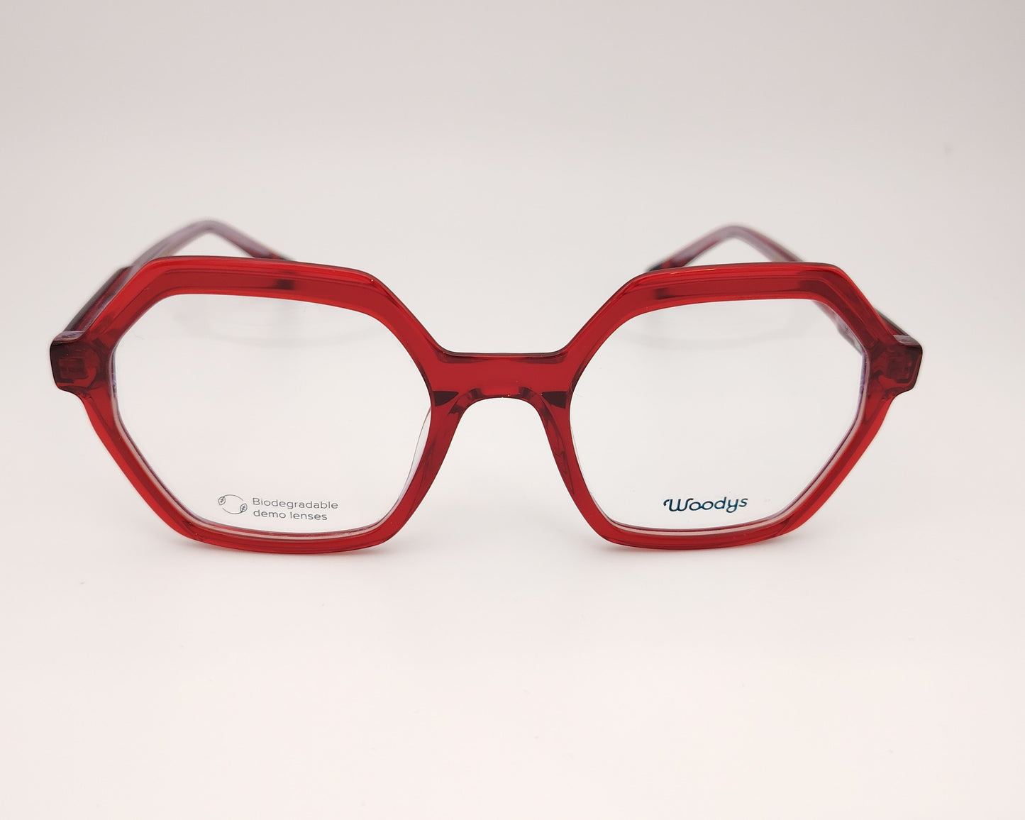 woodys nona 04 gafas de acetato en formato hexagonal de color rojo traslúcido