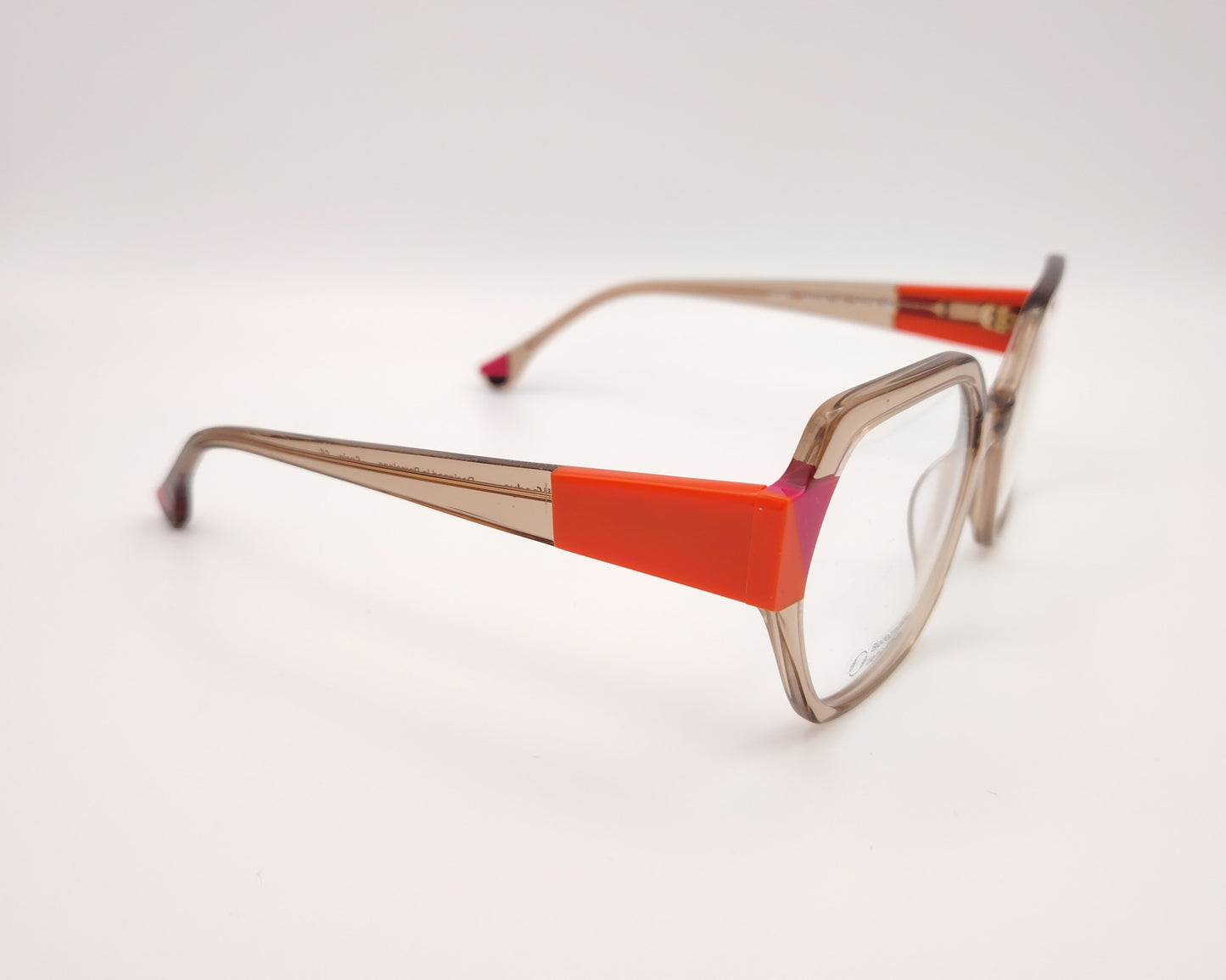 gafas woodys savoye 04 montura geométrica nude translúcido detalles naranja y fucsia diseño moderno y atrevido