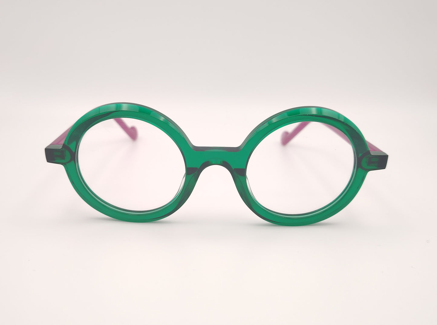 gafas graduadas xit v117 redondas con frontal verde transparente y varillas fucsia