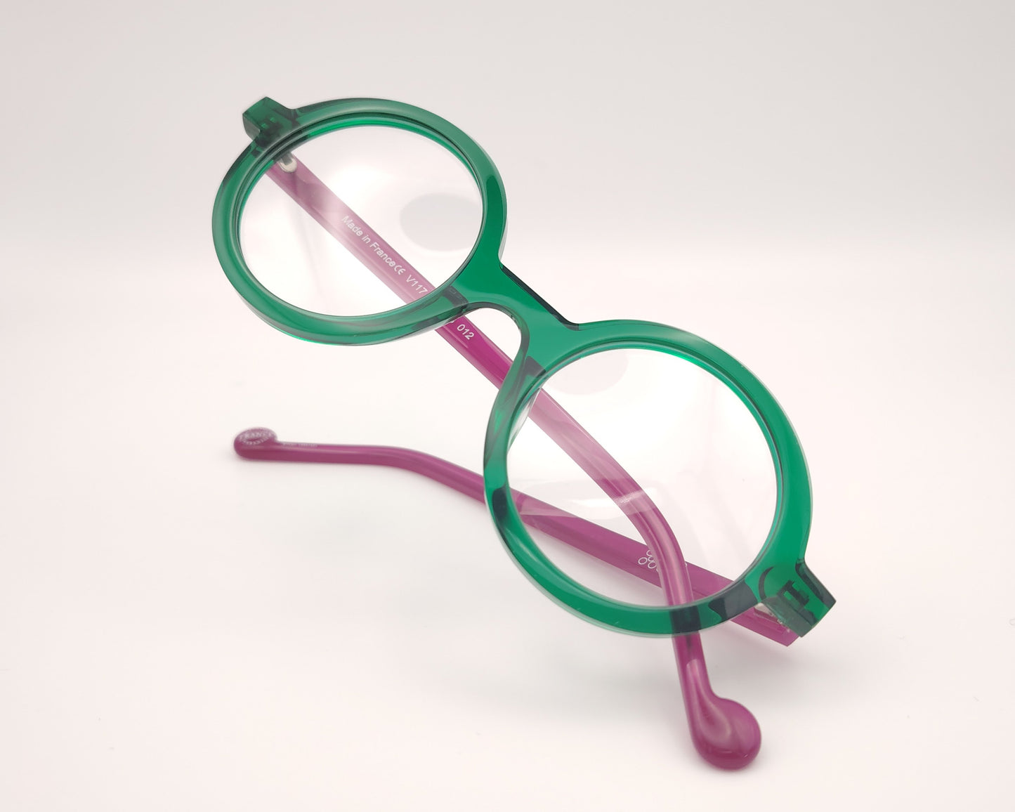gafas graduadas xit v117 redondas con frontal verde transparente y varillas fucsia