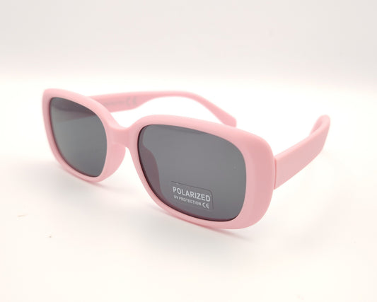 gafas de sol infantiles polarizadas con montura rectangular rosa pastel mate y lentes grises con protección uv