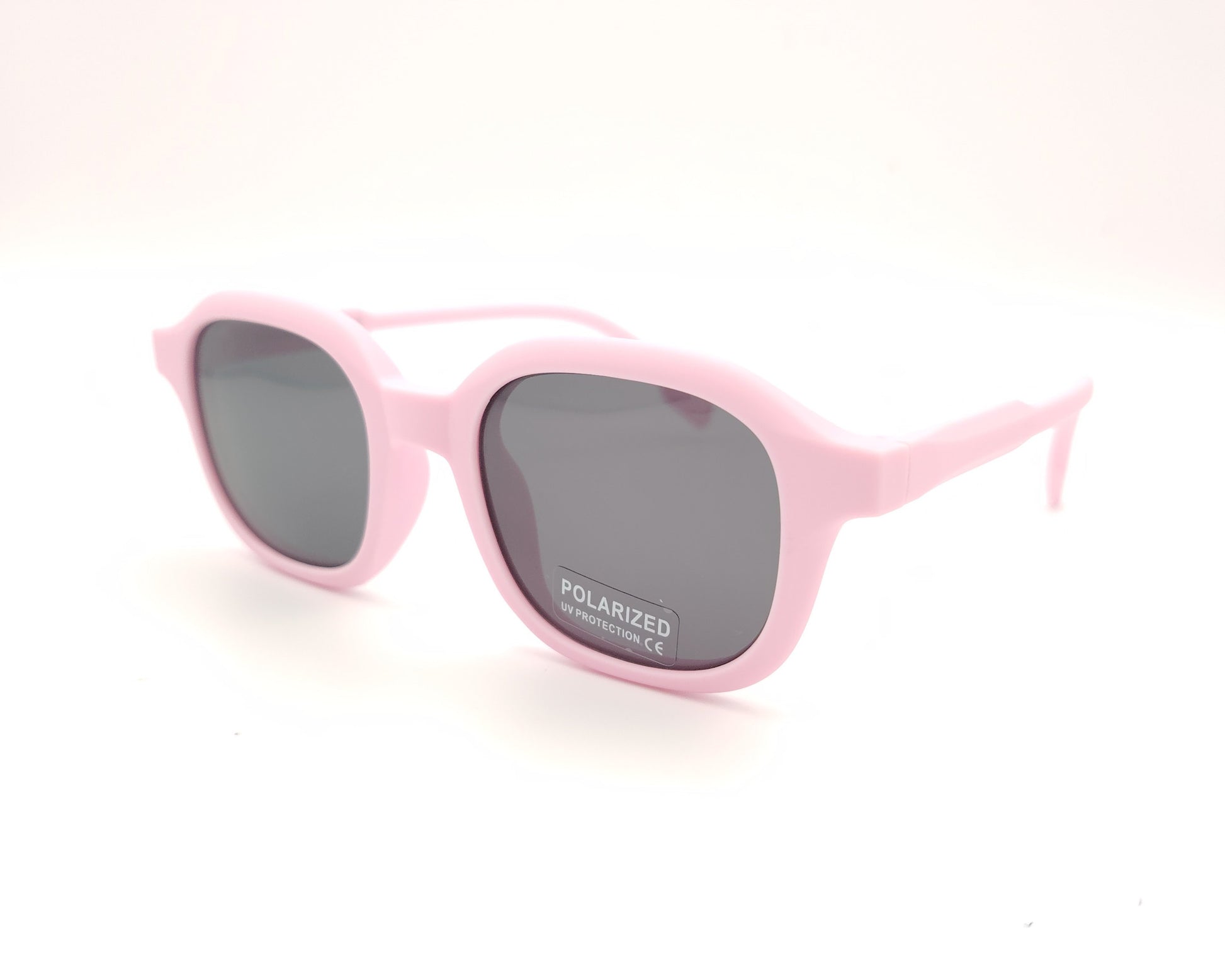 gafas de sol infantiles polarizadas con montura rosa claro y lentes grises con protección uv.